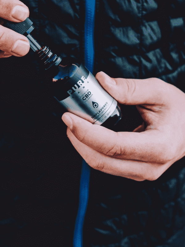 Woman using PureKana CBD products